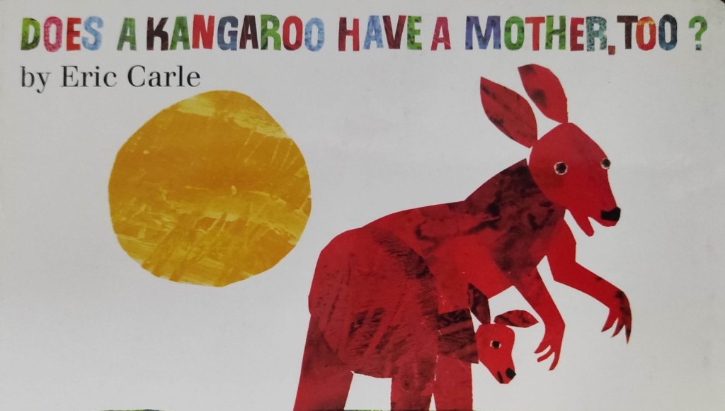 The cover has a kangaroo mother carrying her joey in her pouch. The sun is visible in the background.