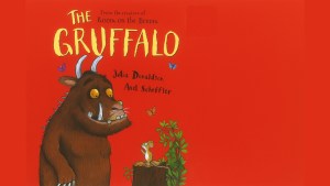 The cover of the Gruffalo showing the mythical beast next to a mouse on a red background.